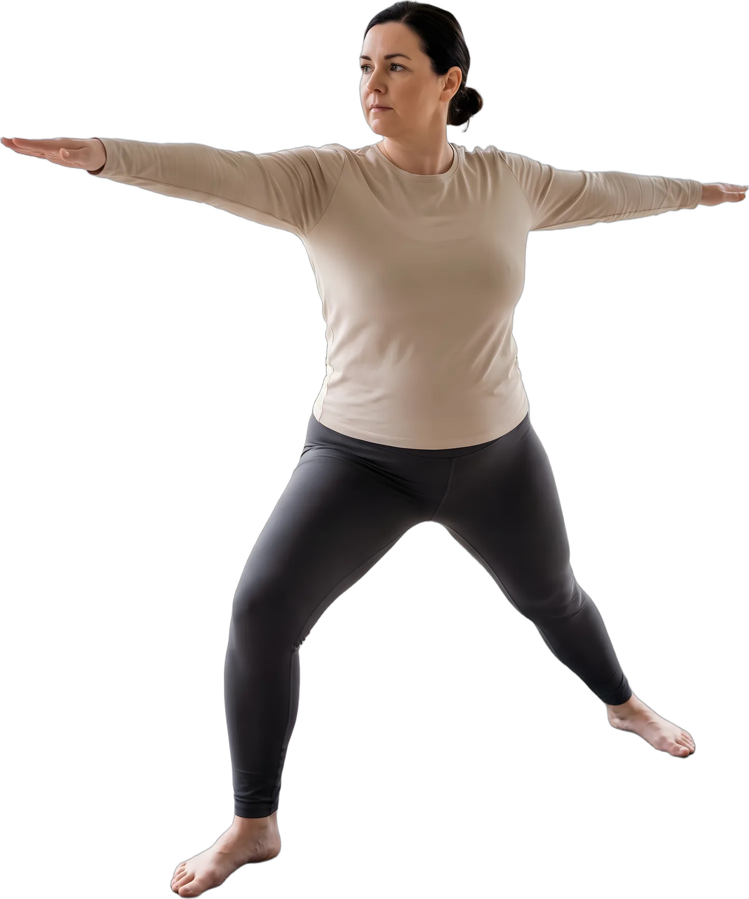 Woman holding a warrior pose on a mat in a bright studio
